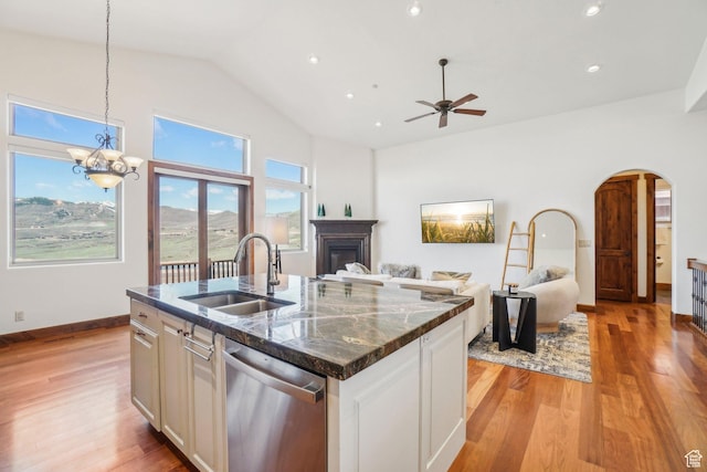 12221 Ross Creek Dr Unit 137, Kamas, UT 84036 - kitchen with ceiling fan with notable chandelier, a sink, a fireplace, open floor plan, and stainless steel dishwasher