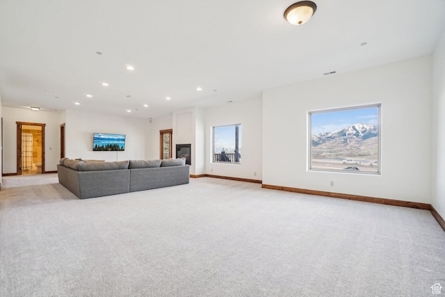12221 Ross Creek Dr Unit 137, Kamas, UT 84036 - living area with light carpet, baseboards, and recessed lighting