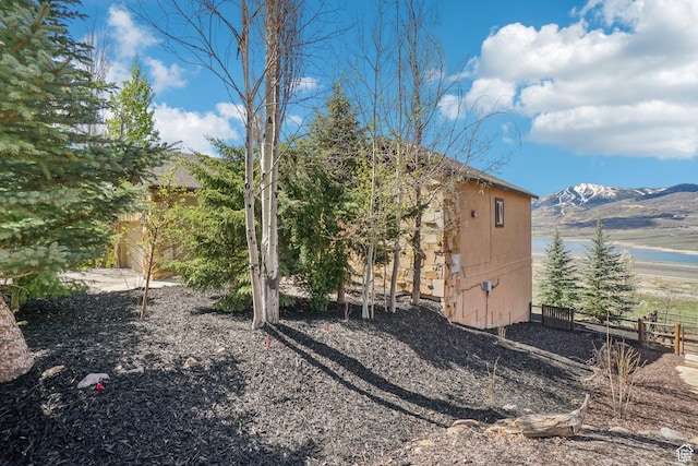12221 Ross Creek Dr Unit 137, Kamas, UT 84036 - view of side of property featuring fence and a water and mountain view