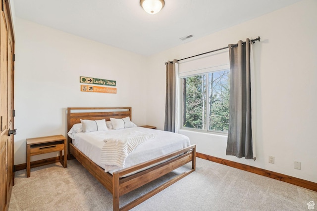 12221 Ross Creek Dr Unit 137, Kamas, UT 84036 - bedroom featuring light carpet, baseboards, and visible vents
