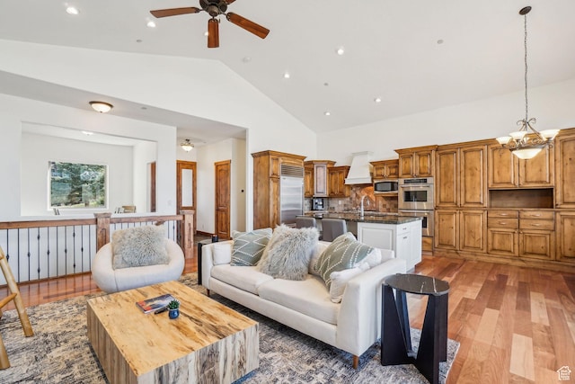 12221 Ross Creek Dr Unit 137, Kamas, UT 84036 - living area with high vaulted ceiling, light wood-type flooring, a ceiling fan, and recessed lighting