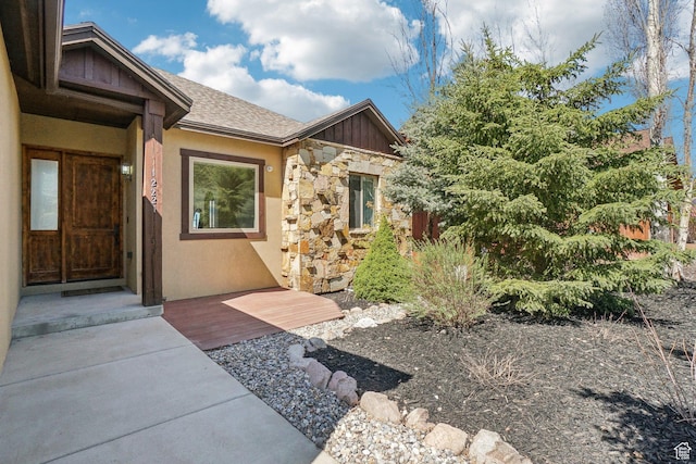 12221 Ross Creek Dr Unit 137, Kamas, UT 84036 - doorway to property with a shingled roof, stucco siding, stone siding, and board and batten siding