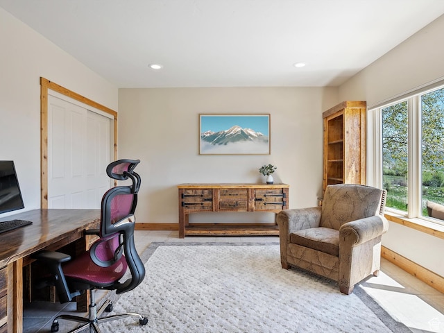 office space with baseboards and recessed lighting