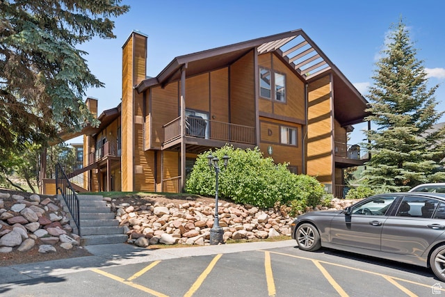 2025 Canyons Resort Dr Unit D4, Park City, UT 84098 - view of building exterior with uncovered parking and stairway