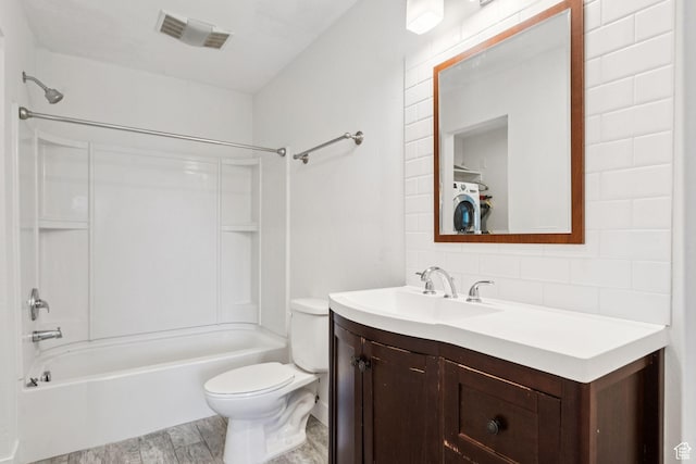 2025 Canyons Resort Dr Unit D4, Park City, UT 84098 - bathroom with vanity,  shower combination, tasteful backsplash, wood finished floors, and washer / dryer