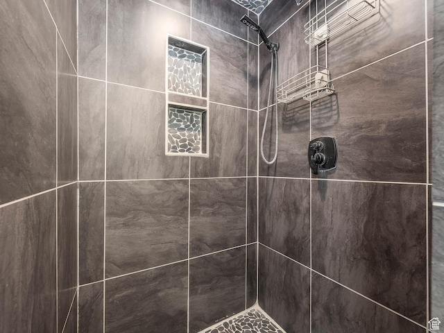 room details with a tile shower