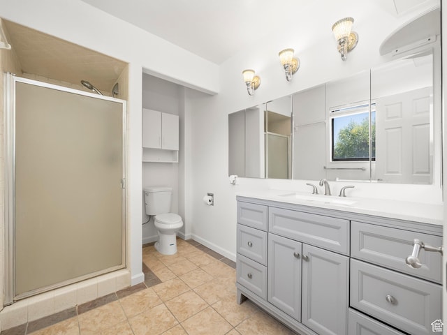 bathroom with a stall shower, baseboards, toilet, tile patterned floors, and vanity