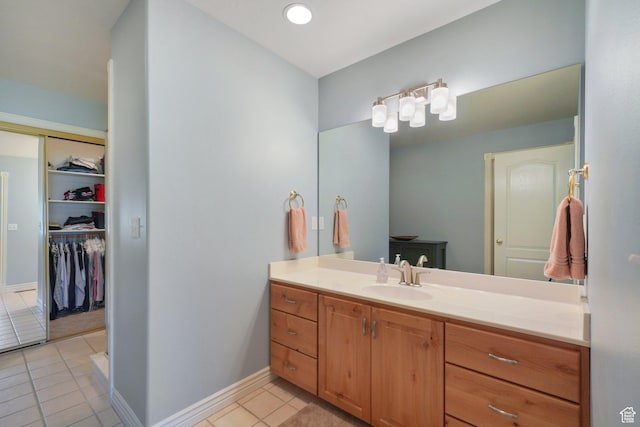 384 N Cottage Creek Ct W, Midway, UT 84049 - bathroom with baseboards, tile patterned floors, vanity, and a walk in closet