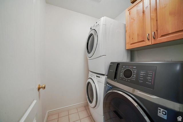 384 N Cottage Creek Ct W, Midway, UT 84049 - laundry room with cabinet space, tile patterned floors, baseboards, and stacked washer and clothes dryer