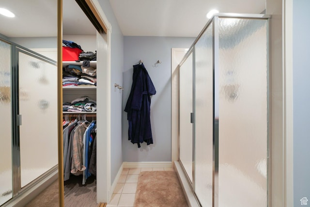 384 N Cottage Creek Ct W, Midway, UT 84049 - full bathroom featuring a stall shower, tile patterned flooring, a spacious closet, and baseboards