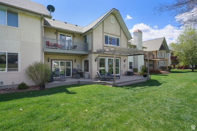 384 N Cottage Creek Ct W, Midway, UT 84049 - back of property featuring stucco siding, a pergola, a lawn, and a balcony