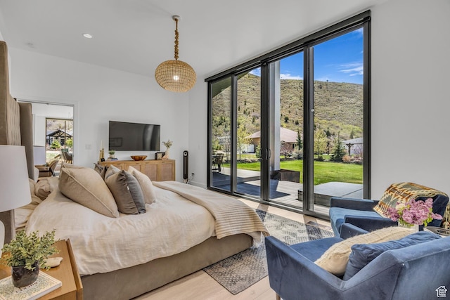 846 E 270 S, Kamas, UT 84036 - bedroom featuring access to exterior, a wall of windows, and light wood-style flooring