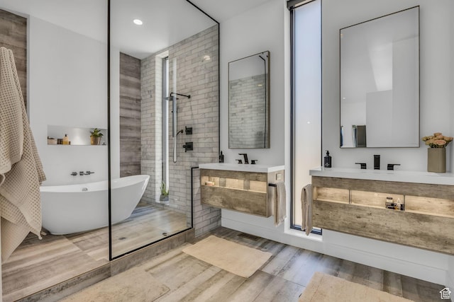 846 E 270 S, Kamas, UT 84036 - full bath with wood finished floors, a tile shower, two vanities, a freestanding bath, and recessed lighting