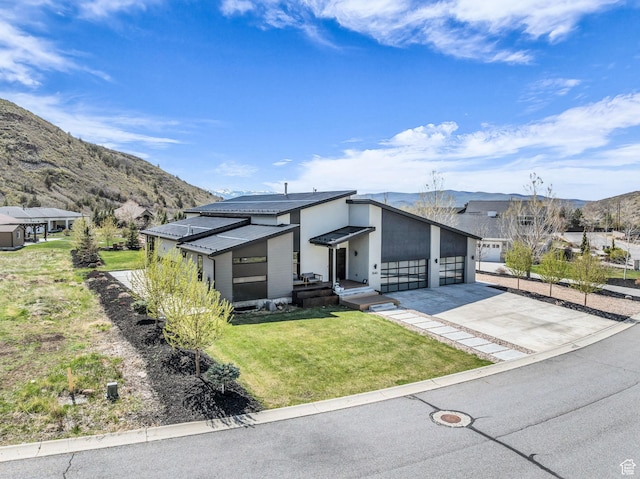 846 E 270 S, Kamas, UT 84036 - view of front facade with a mountain view, a front yard, concrete driveway, and an attached garage