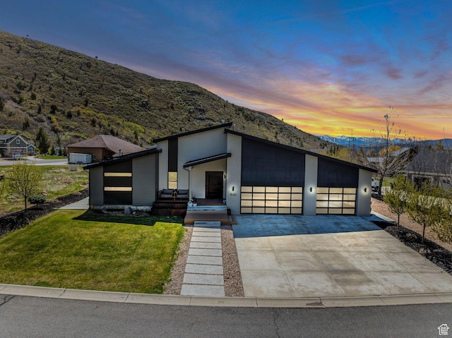 846 E 270 S, Kamas, UT 84036 - contemporary house featuring a mountain view, an attached garage, a front yard, and driveway