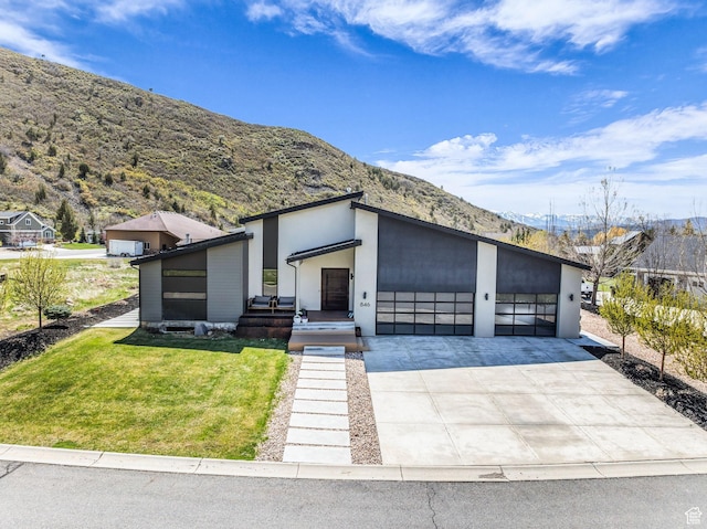 846 E 270 S, Kamas, UT 84036 - view of front of house with a mountain view, a front yard, driveway, and a garage