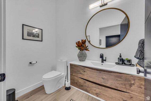 846 E 270 S, Kamas, UT 84036 - half bathroom with toilet, wood finished floors, vanity, and baseboards