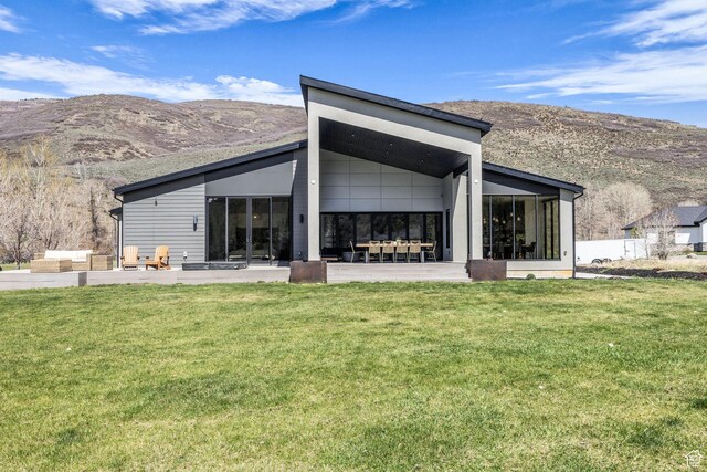846 E 270 S, Kamas, UT 84036 - back of house with a mountain view, a sunroom, and a lawn