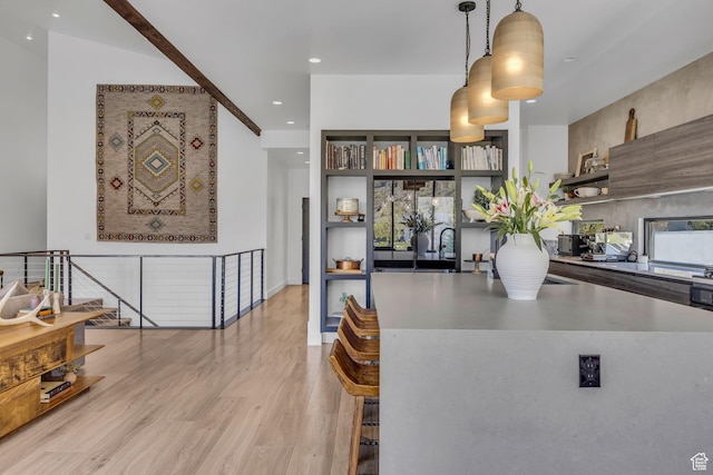 846 E 270 S, Kamas, UT 84036 - kitchen featuring open shelves, light wood-style flooring, decorative light fixtures, recessed lighting, and a kitchen bar