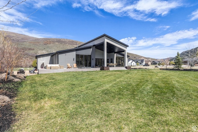 846 E 270 S, Kamas, UT 84036 - back of property with a lawn, a mountain view, a sunroom, and a patio
