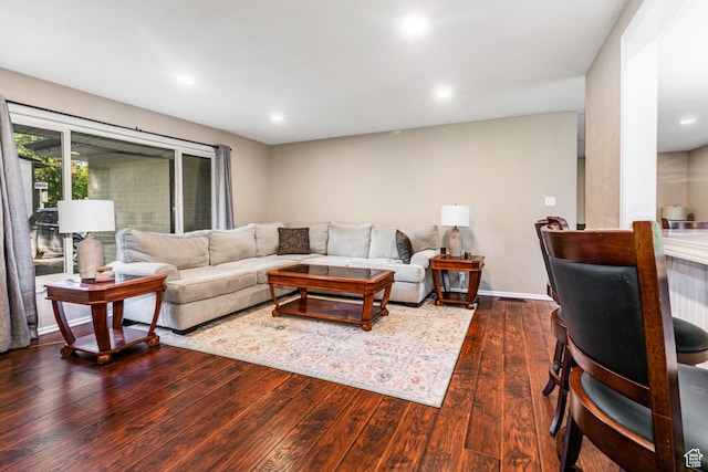 living area featuring recessed lighting and dark wood-style floors