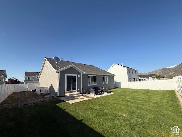 88 E 970 N, Santaquin, UT 84655 - back of house with a yard, entry steps, a patio area, and a fenced backyard