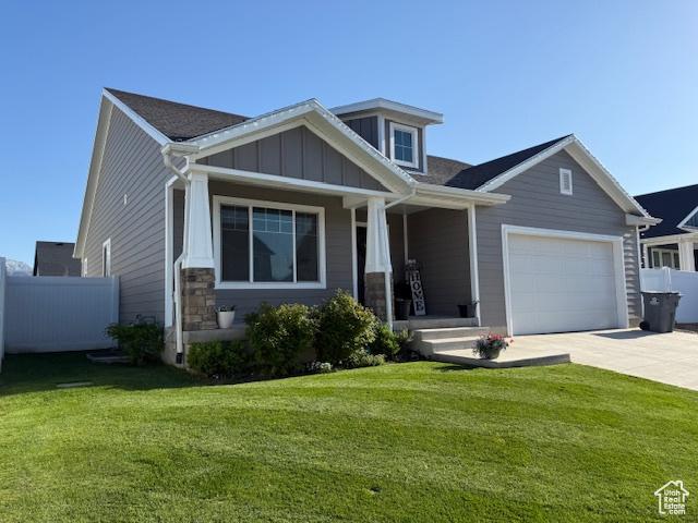 88 E 970 N, Santaquin, UT 84655 - craftsman inspired home with covered porch, concrete driveway, fence, and a front yard