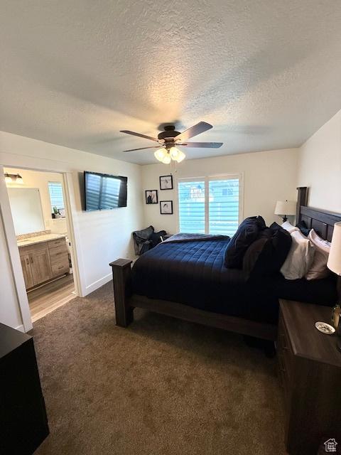88 E 970 N, Santaquin, UT 84655 - bedroom featuring ceiling fan, connected bathroom, a textured ceiling, and dark carpet