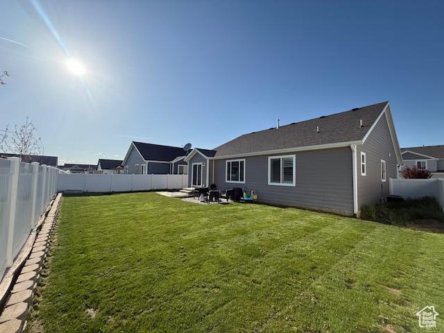 88 E 970 N, Santaquin, UT 84655 - rear view of house with a fenced backyard, a patio, and a yard