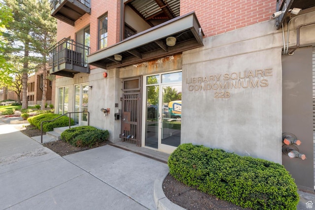 228 E 500 S Unit 301, Salt Lake City, UT 84111 - doorway to property with a balcony and brick siding