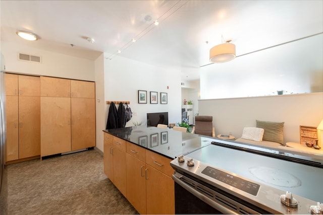 228 E 500 S Unit 301, Salt Lake City, UT 84111 - kitchen featuring dark countertops, visible vents, and stainless steel electric stove