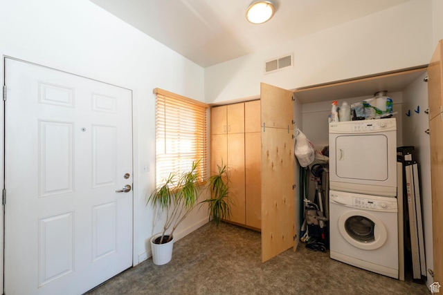 228 E 500 S Unit 301, Salt Lake City, UT 84111 - washroom with stacked washing maching and dryer, carpet, laundry area, and visible vents