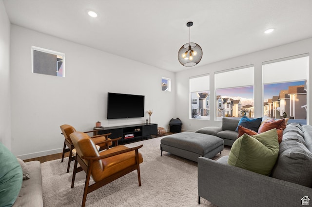 living room with baseboards, recessed lighting, and wood finished floors