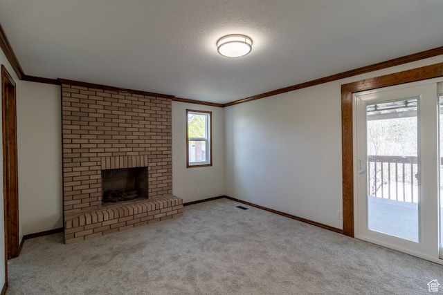 unfurnished living room with crown molding, carpet flooring, a brick fireplace, and visible vents