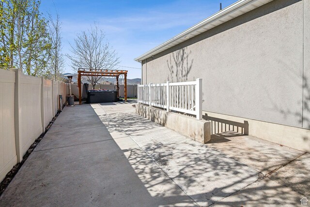 667 S Falkirk Rd Unit 24, Heber City, UT 84032 - view of patio / terrace featuring a pergola, a hot tub, and a fenced backyard