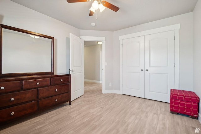 667 S Falkirk Rd Unit 24, Heber City, UT 84032 - unfurnished bedroom featuring baseboards, a closet, light wood-style flooring, and ceiling fan