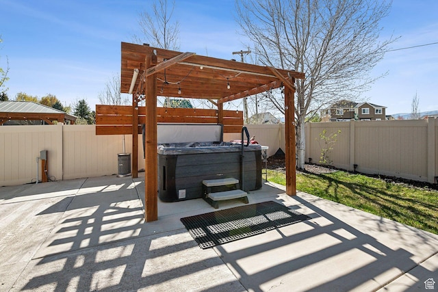 667 S Falkirk Rd Unit 24, Heber City, UT 84032 - view of patio / terrace with a hot tub and a fenced backyard