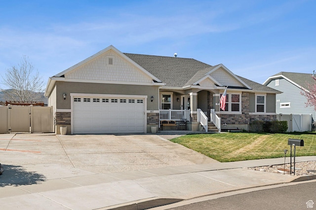 667 S Falkirk Rd Unit 24, Heber City, UT 84032 - craftsman-style house featuring a gate, covered porch, an attached garage, stone siding, and a front lawn