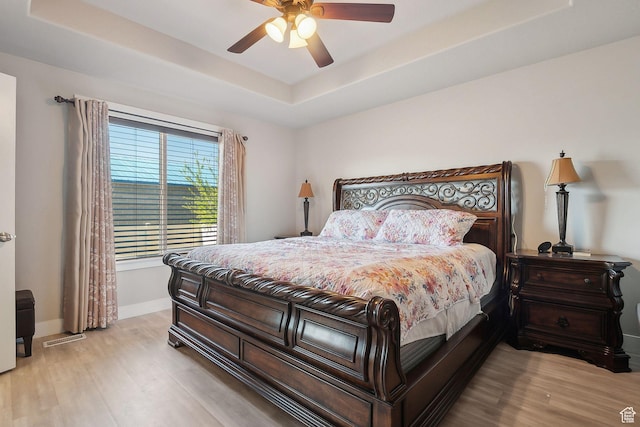 667 S Falkirk Rd Unit 24, Heber City, UT 84032 - bedroom featuring a tray ceiling, baseboards, visible vents, and wood finished floors