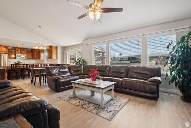 667 S Falkirk Rd Unit 24, Heber City, UT 84032 - living area with light wood finished floors, ceiling fan with notable chandelier, and vaulted ceiling