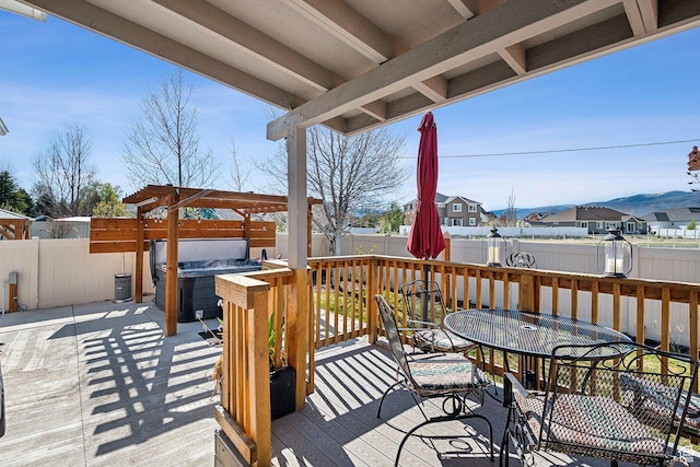 667 S Falkirk Rd Unit 24, Heber City, UT 84032 - deck featuring a patio, a residential view, outdoor dining space, a hot tub, and a fenced backyard