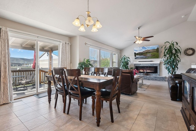 667 S Falkirk Rd Unit 24, Heber City, UT 84032 - dining space with lofted ceiling, a fireplace, light tile patterned floors, and ceiling fan with notable chandelier