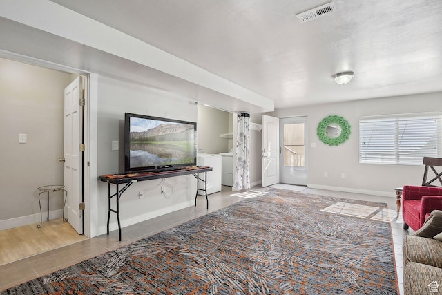 667 S Falkirk Rd Unit 24, Heber City, UT 84032 - living area featuring baseboards, tile patterned flooring, visible vents, and washer and clothes dryer