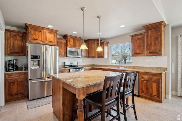 667 S Falkirk Rd Unit 24, Heber City, UT 84032 - kitchen featuring light stone counters, tasteful backsplash, appliances with stainless steel finishes, and a sink