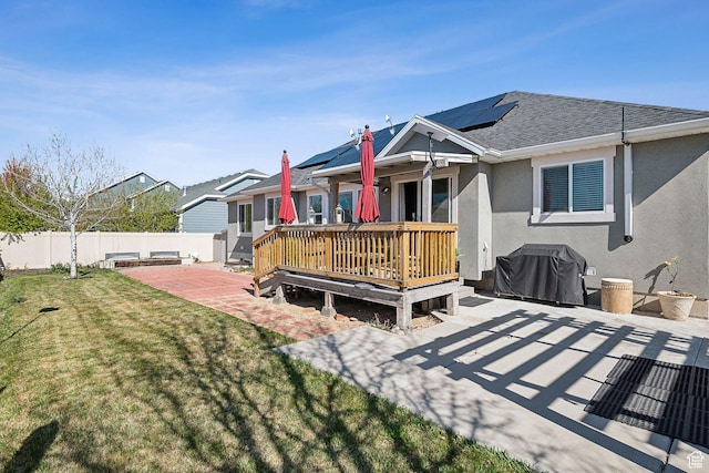667 S Falkirk Rd Unit 24, Heber City, UT 84032 - back of house featuring stucco siding, a wooden deck, a lawn, a fenced backyard, and roof with shingles