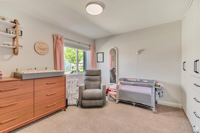 bedroom with light carpet and arched walkways
