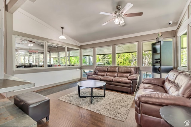 living room featuring vaulted ceiling, wood finished floors, and a ceiling fan