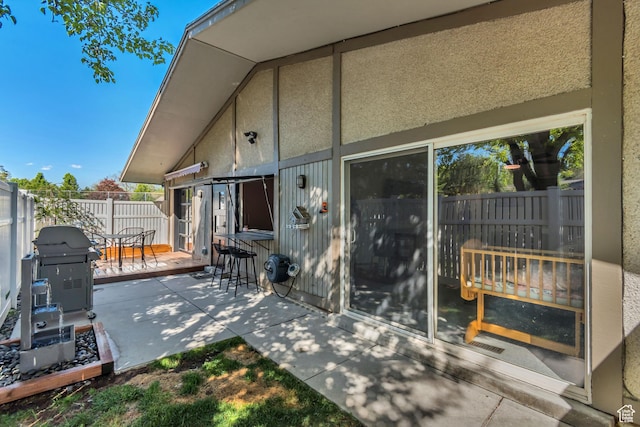 view of patio / terrace featuring area for grilling and fence