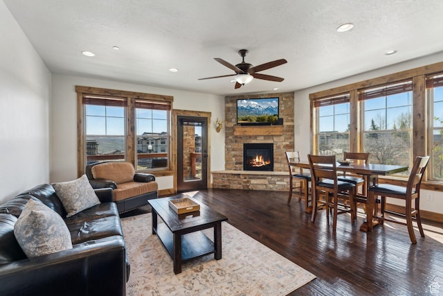9855 N N Vista Dr Unit 104, Heber City, UT 84032 - living area featuring a stone fireplace, a ceiling fan, hardwood / wood-style floors, and recessed lighting
