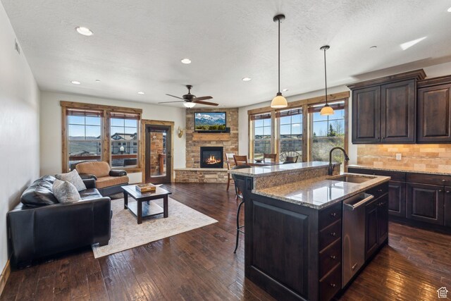 9855 N N Vista Dr Unit 104, Heber City, UT 84032 - kitchen featuring a sink, a wealth of natural light, open floor plan, and dark wood finished floors